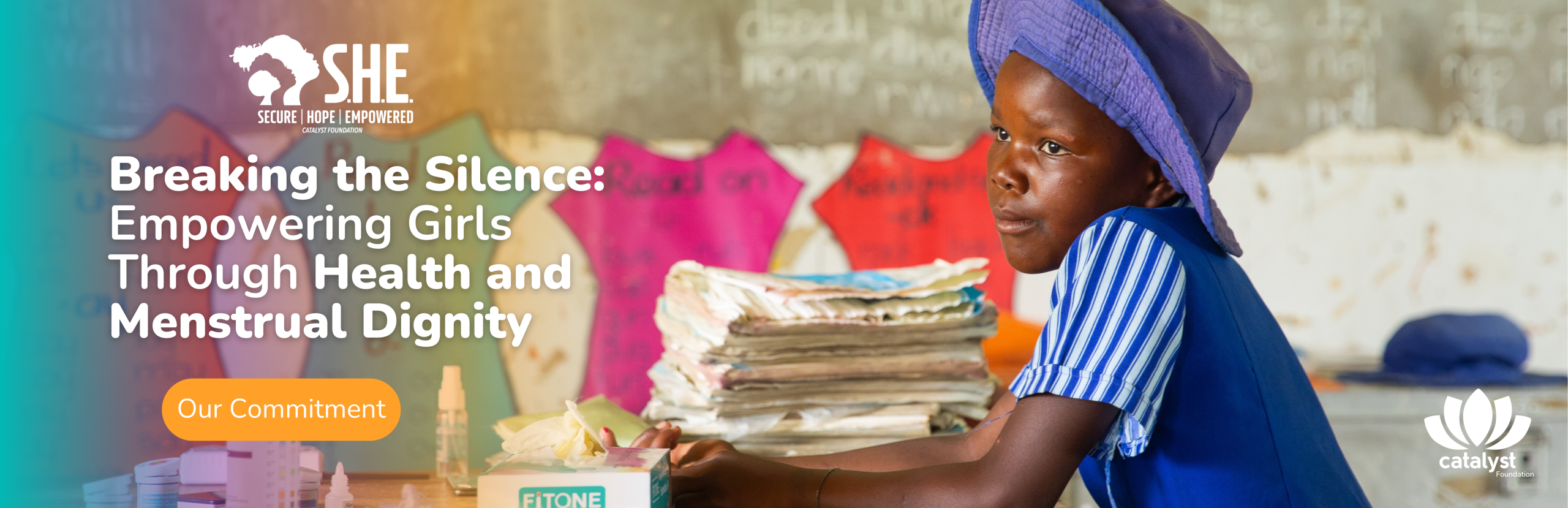 S.H.E. Programme banner with the text "Breaking the Silence: Empowering Girls Through Health and Menstrual Dignity." A young African girl sits at a table with educational materials and sanitary products, illustrating the program's work.
