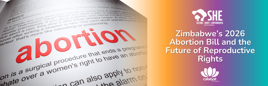 A wide banner showing a close-up, angled view of a dictionary or textbook page where the word "abortion" is printed in bold red letters. The right side of the image transitions into an orange and purple gradient featuring the "S.H.E. Secure Hope Empowered" and "Catalyst Foundation" logos. The primary text reads: "Zimbabwe’s 2026 Abortion Bill and the Future of Reproductive Rights."